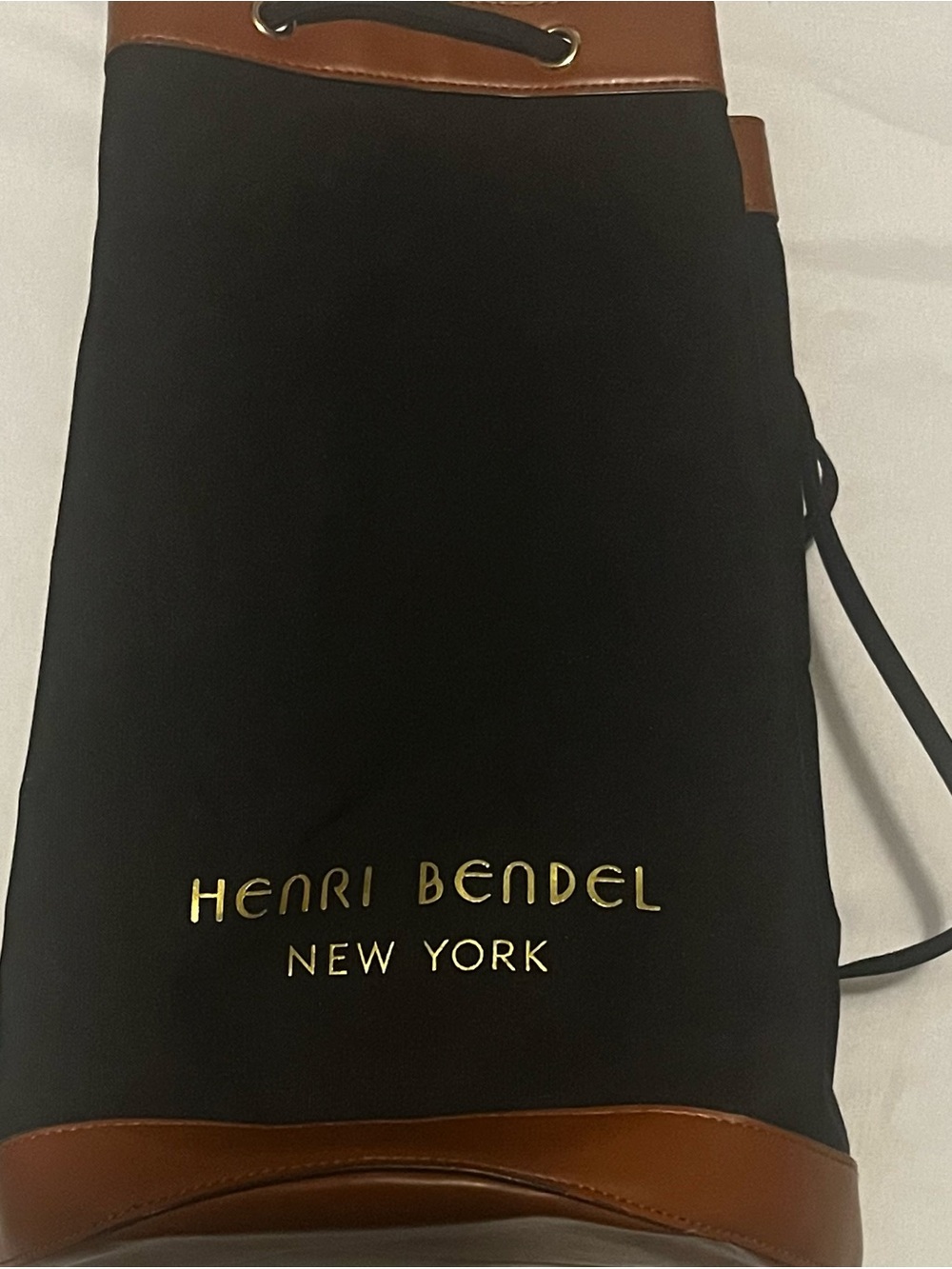 Henri Bendel Black and Brown Drawstring Backpack with Gold Logo